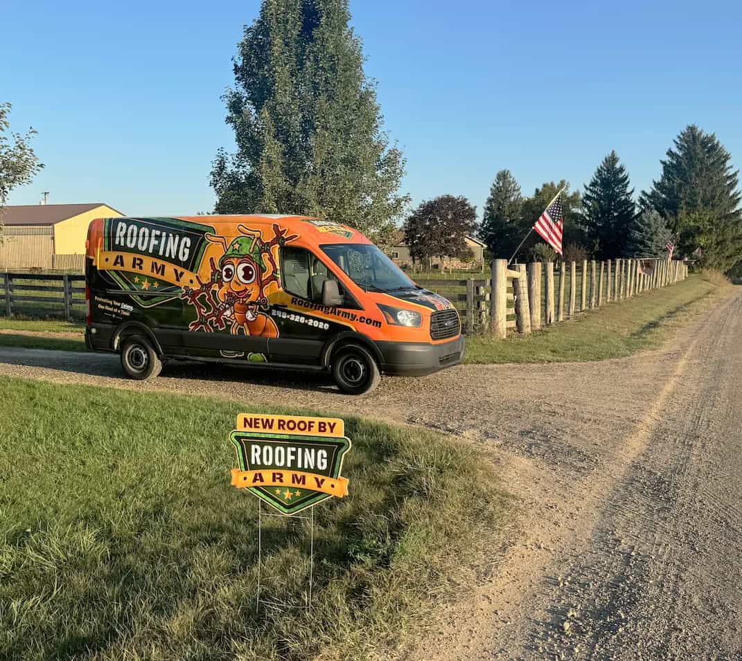 Roofing Army - Mission-Ready SE Michigan Roofing Company roofing army van parked in front of a roofing army sign and an america flag on a dirt road