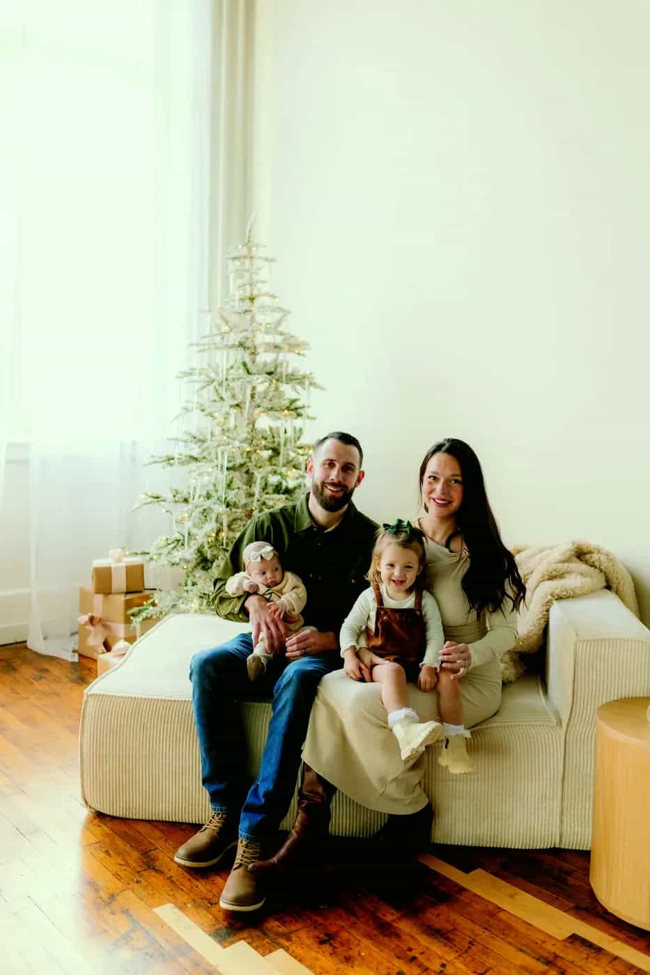 Aaron Scott, owner of Roofing Army, with his wife and two daughters