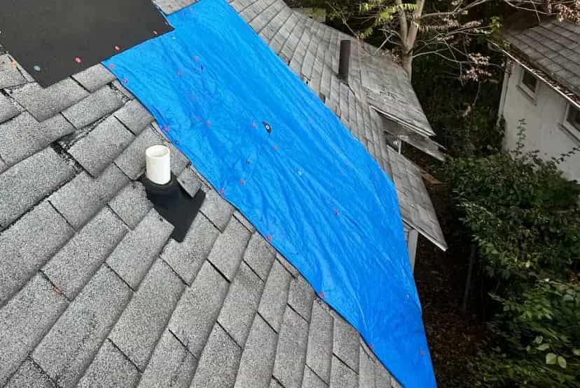 Emergency Tarping Services in Michigan - Roofing Army asphalt shingle roof in michigan with emergency tarping to cover damage